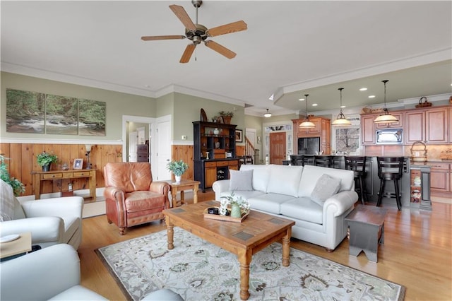 79 Strawberry Way, Jasper, GA 30143 - living room with light wood-style flooring, ornamental molding, a ceiling fan, a wainscoted wall, and recessed lighting