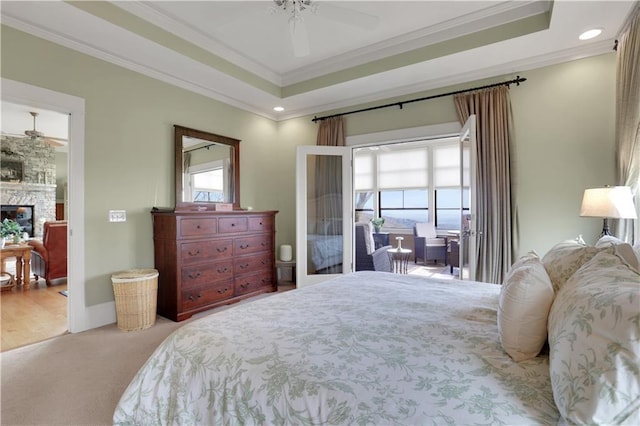 79 Strawberry Way, Jasper, GA 30143 - carpeted bedroom featuring crown molding, a raised ceiling, a stone fireplace, recessed lighting, and ceiling fan