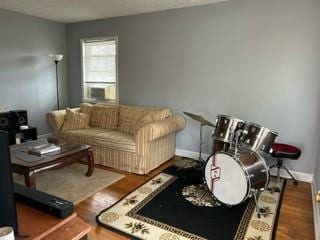 living area featuring wood finished floors and baseboards