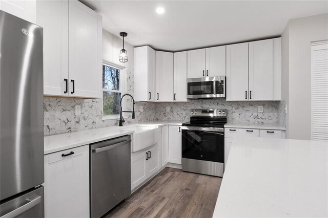 empty room with recessed lighting, visible vents, baseboards, and wood finished floors