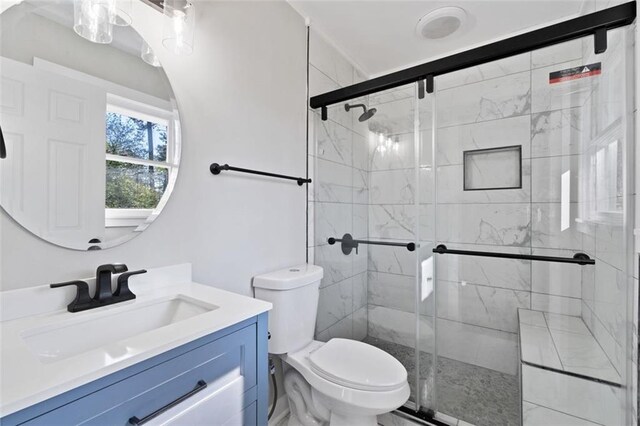 bathroom with vanity, visible vents, toilet, marble finish floor, and baseboards