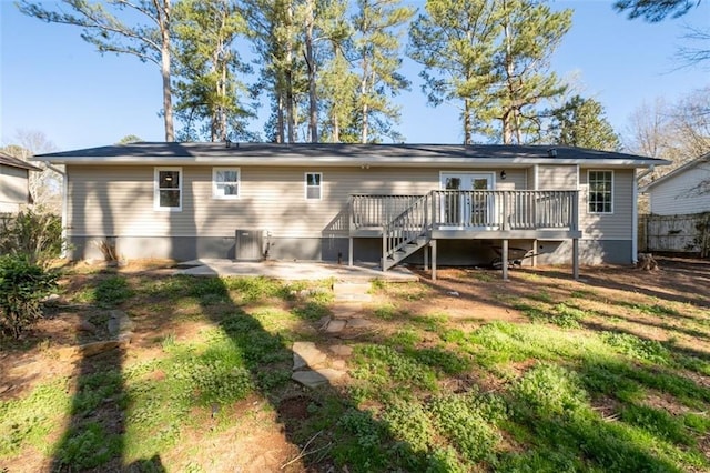 back of house with a wooden deck, fence, central AC unit, and stairway