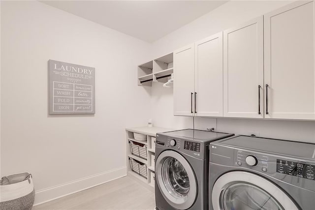 laundry room featuring cabinets and independent washer and dryer