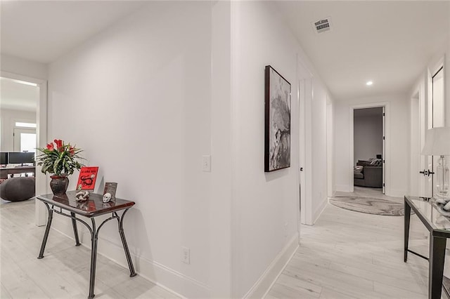 hallway featuring light hardwood / wood-style flooring