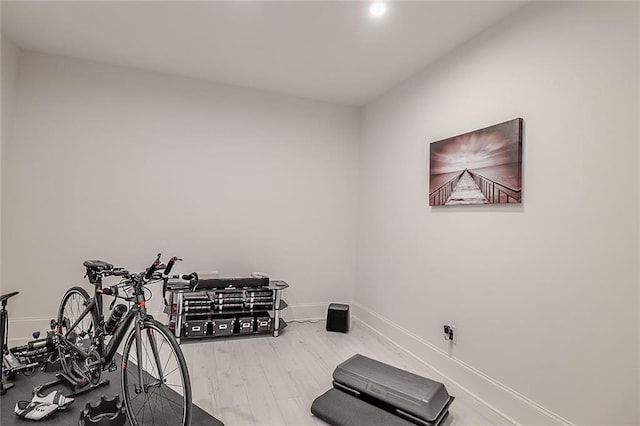 workout room with hardwood / wood-style flooring