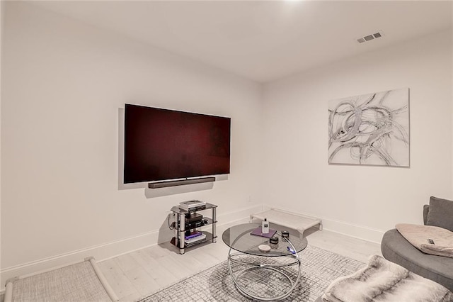 living room with light hardwood / wood-style flooring