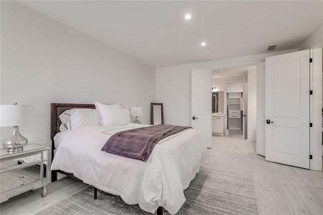 bedroom with light wood-type flooring