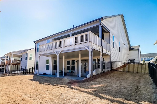 rear view of property featuring a patio