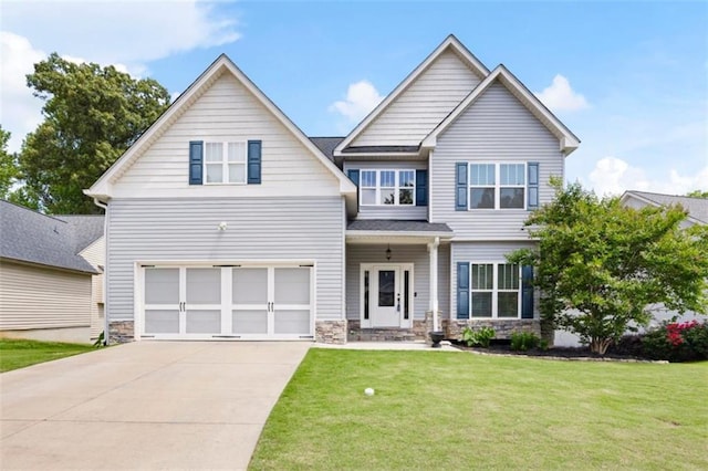 1016 Buckeye Ln, Villa Rica, GA 30180 - craftsman inspired home featuring a garage, driveway, stone siding, and a front lawn