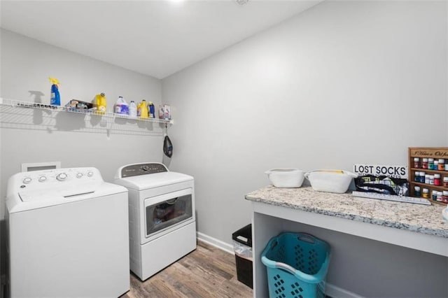 1016 Buckeye Ln, Villa Rica, GA 30180 - washroom featuring washer and dryer, light wood-type flooring, and baseboards