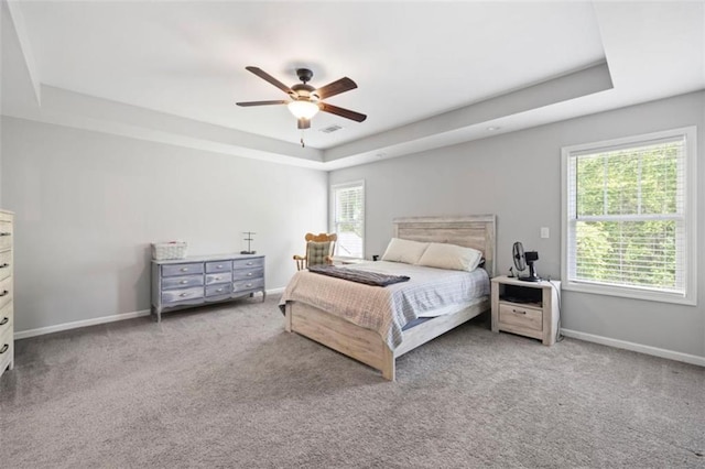 1016 Buckeye Ln, Villa Rica, GA 30180 - carpeted bedroom with a raised ceiling, baseboards, and a ceiling fan