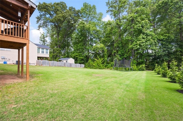 1016 Buckeye Ln, Villa Rica, GA 30180 - view of yard featuring a trampoline and a wooden deck