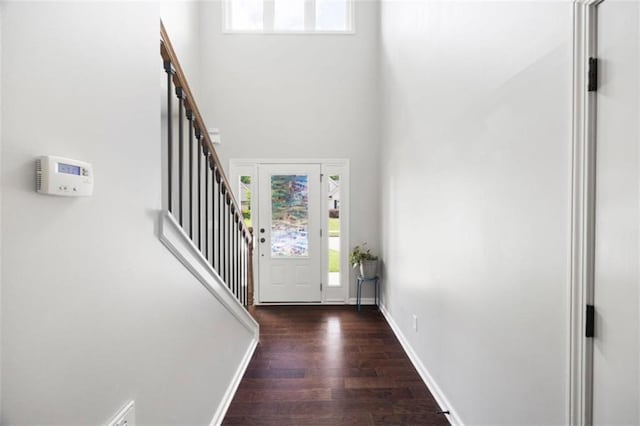 1016 Buckeye Ln, Villa Rica, GA 30180 - entrance foyer featuring wood finished floors, plenty of natural light, a towering ceiling, baseboards, and stairway