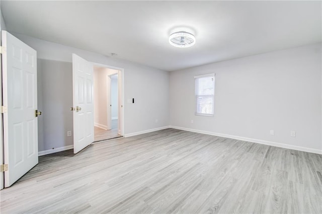 unfurnished bedroom with light wood-type flooring