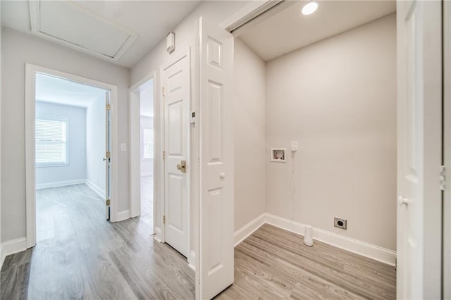 washroom with washer hookup, light hardwood / wood-style flooring, and electric dryer hookup