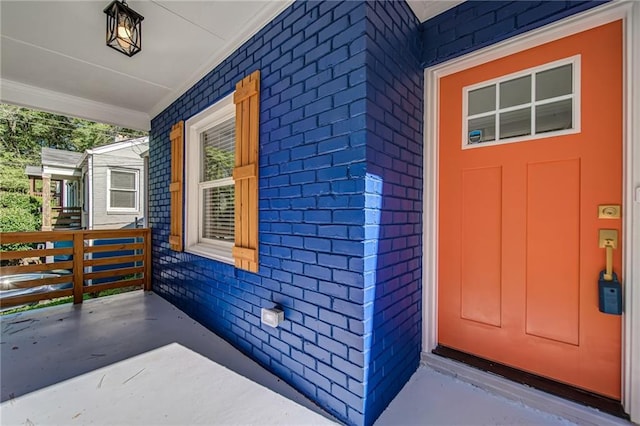 entrance to property with covered porch