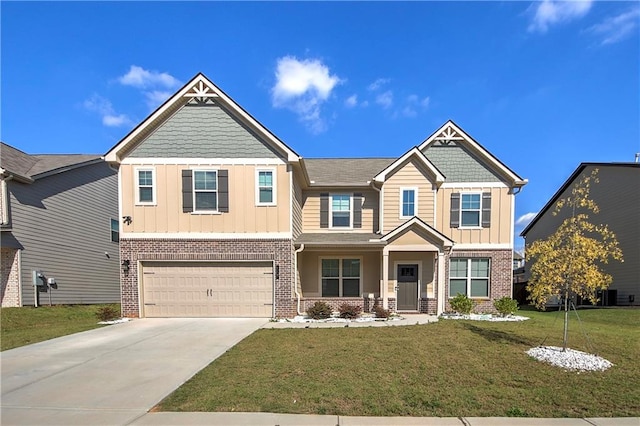 craftsman-style house with a garage and a front lawn