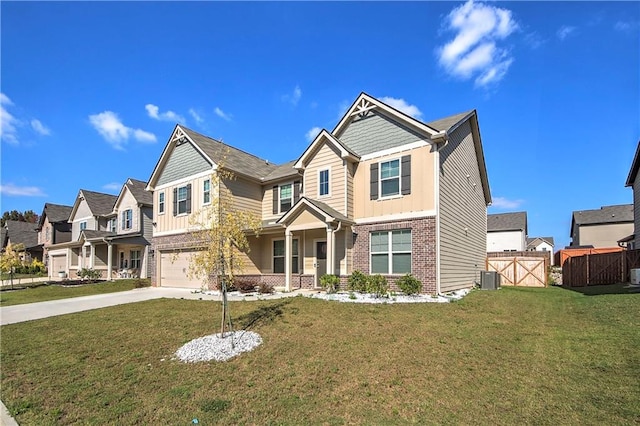 craftsman-style house featuring central AC unit, a garage, and a front lawn