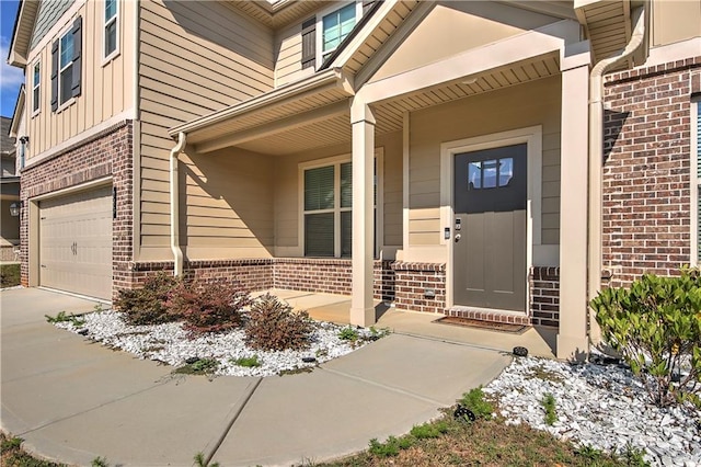 view of exterior entry with a garage