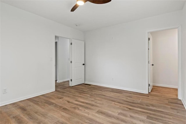 unfurnished bedroom featuring light hardwood / wood-style floors and ceiling fan