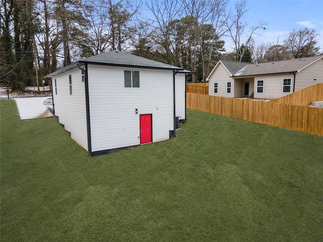 view of outdoor structure featuring a lawn