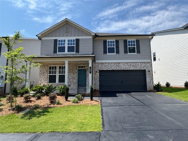 23 Gresham Ct, Dawsonville, GA 30534 - view of front of house with asphalt driveway, board and batten siding, an attached garage, and a front lawn