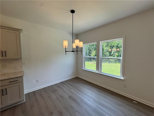 23 Gresham Ct, Dawsonville, GA 30534 - unfurnished dining area with a chandelier and dark wood-type flooring