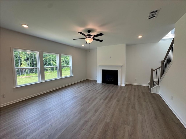 23 Gresham Ct, Dawsonville, GA 30534 - unfurnished living room featuring dark wood-style floors, stairs, a ceiling fan, recessed lighting, and a fireplace