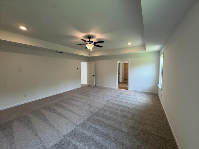 23 Gresham Ct, Dawsonville, GA 30534 - spare room featuring a tray ceiling, carpet floors, ceiling fan, and recessed lighting