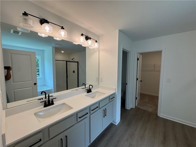 23 Gresham Ct, Dawsonville, GA 30534 - full bath with wood finished floors, a shower stall, double vanity, a bath, and a spacious closet