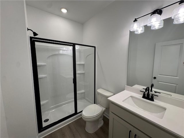 23 Gresham Ct, Dawsonville, GA 30534 - bathroom featuring a shower stall, wood finished floors, and vanity
