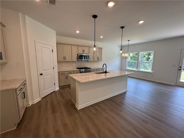23 Gresham Ct, Dawsonville, GA 30534 - kitchen featuring stainless steel appliances, dark wood-style flooring, decorative backsplash, light stone countertops, and decorative light fixtures
