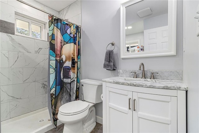 full bath with toilet, a stall shower, and vanity