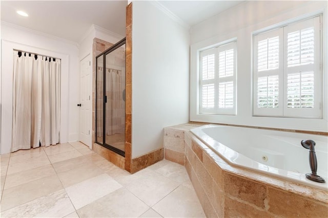 bathroom featuring baseboards, a jetted tub, tile patterned flooring, crown molding, and a shower stall