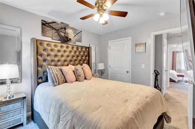 carpeted bedroom with a ceiling fan