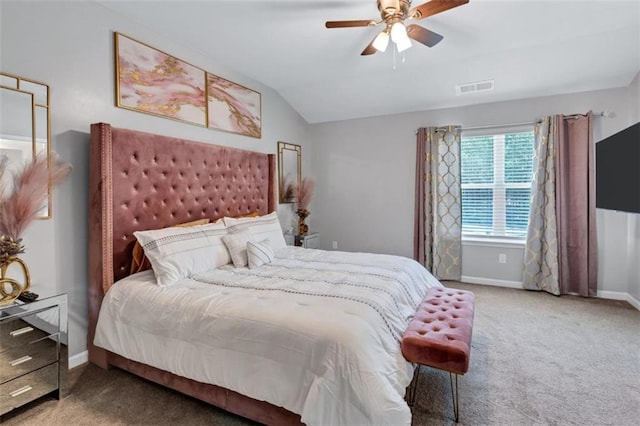 bedroom with vaulted ceiling, baseboards, carpet floors, visible vents, and a ceiling fan