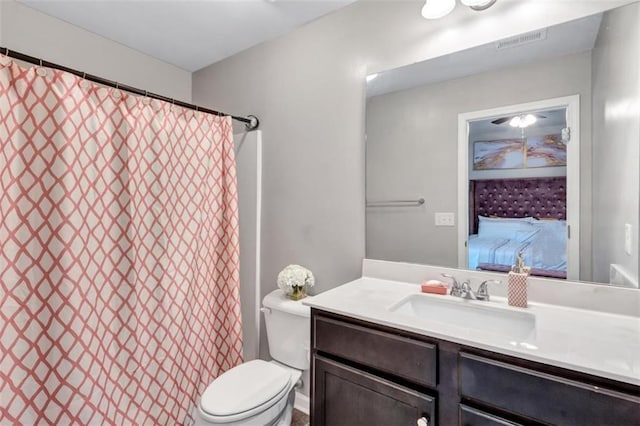full bath featuring visible vents, toilet, and vanity
