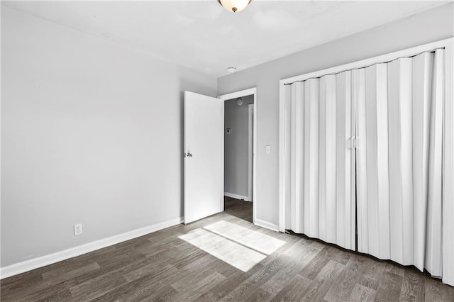 unfurnished bedroom with wood-type flooring