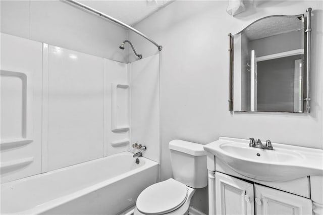 full bathroom featuring toilet, shower / bathing tub combination, a textured ceiling, and vanity