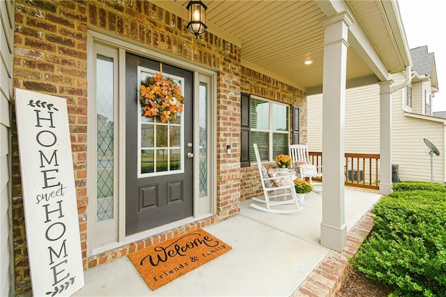 entrance to property featuring covered porch