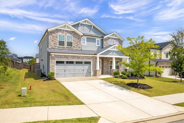 craftsman house featuring a front yard, a garage, and cooling unit