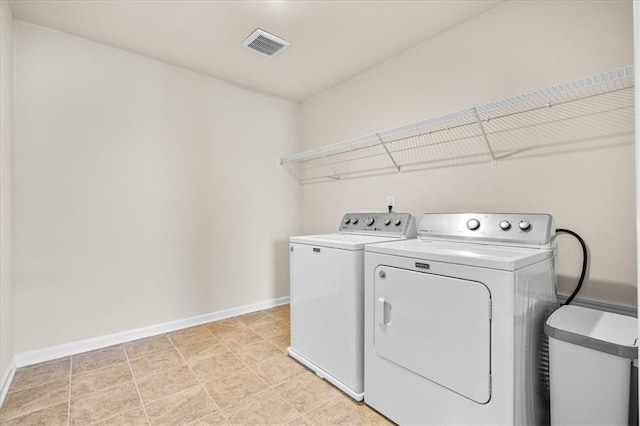 laundry room with washer and clothes dryer