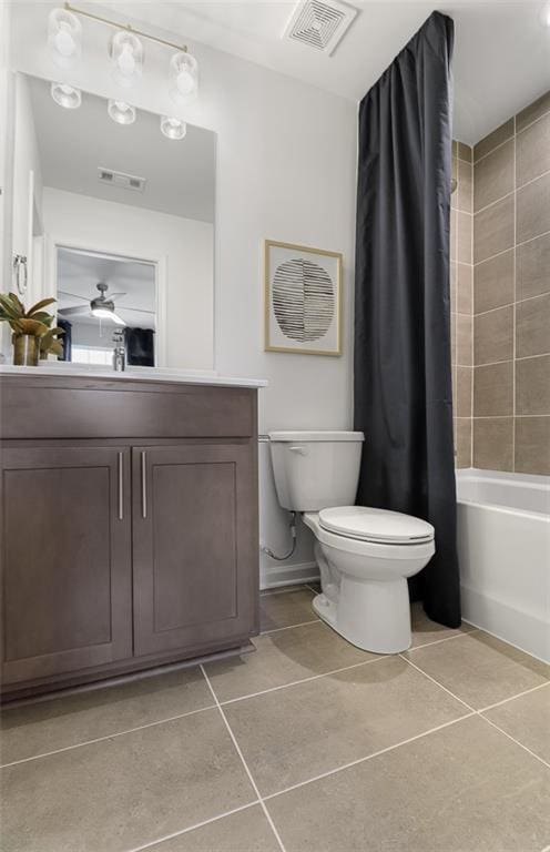 bathroom with toilet, tile patterned flooring, visible vents, and vanity