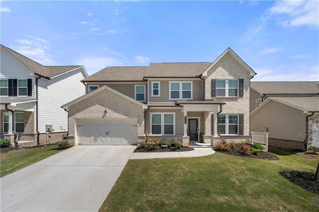 2770 Westgate Park Dr, Loganville, GA 30052 - view of front of home with a garage, brick siding, driveway, and a front lawn