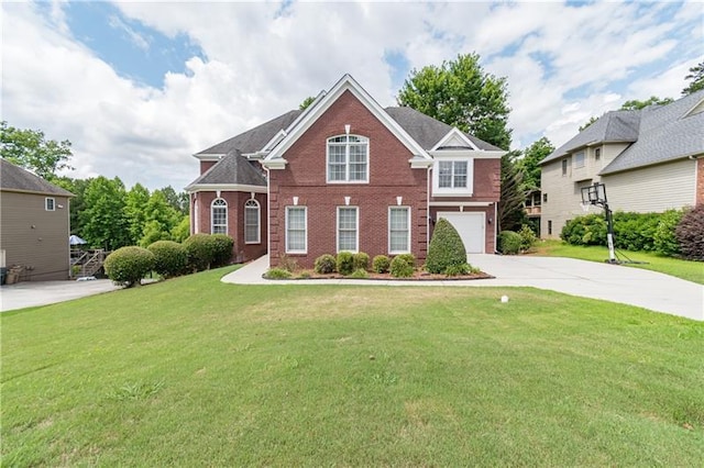 view of front of property with a front lawn and a garage