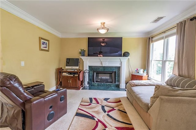 carpeted living room with a premium fireplace and ornamental molding