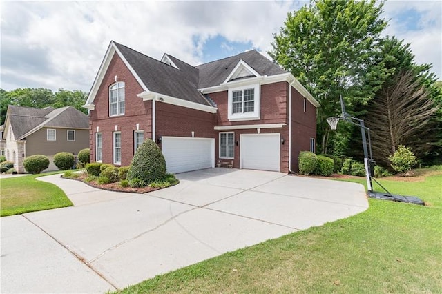 view of front of house featuring a front lawn and a garage