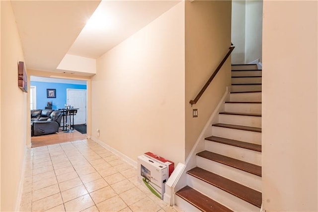 staircase with tile patterned floors