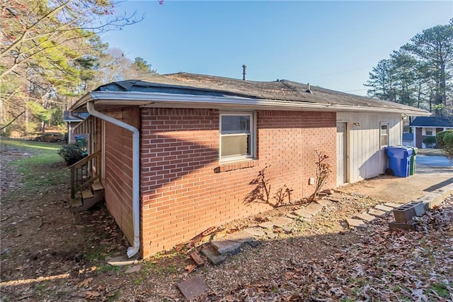 view of home's exterior featuring brick siding