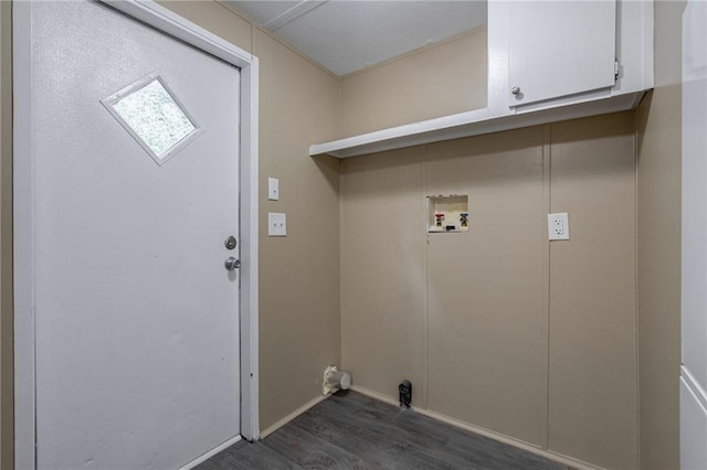 washroom with cabinets, hookup for a washing machine, and dark hardwood / wood-style flooring